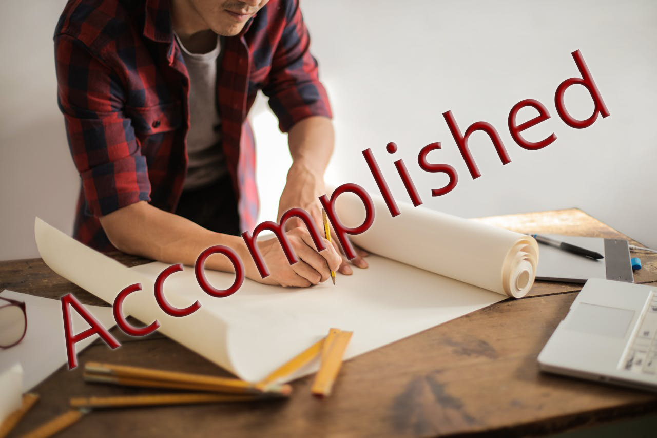 An image of an architect drawing on paper, with the words "Accomplished" over the image.