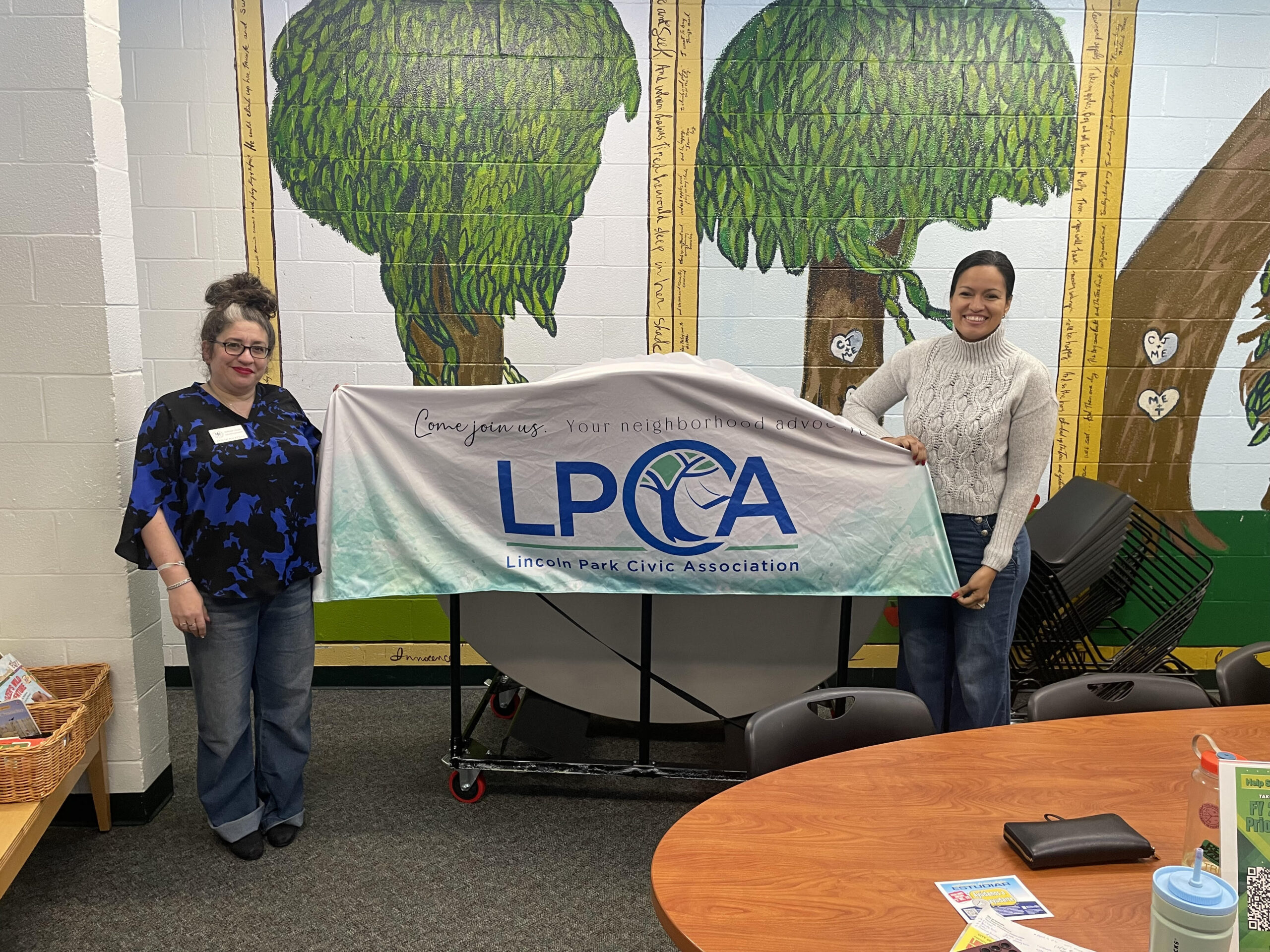 Photo of the Rockville mayor with Councilwoman Marissa holding up an LPCA banner.