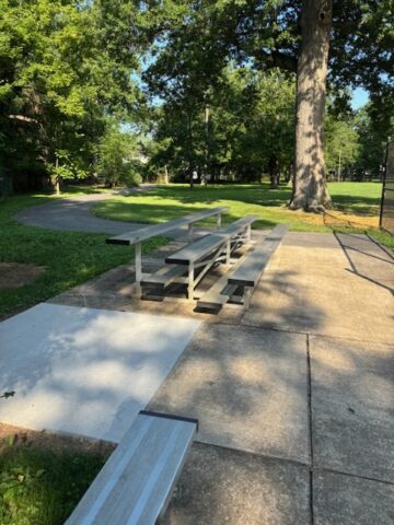 Isreal Park ADA companion pad2 An ADA companion pad near bleachers in a park.